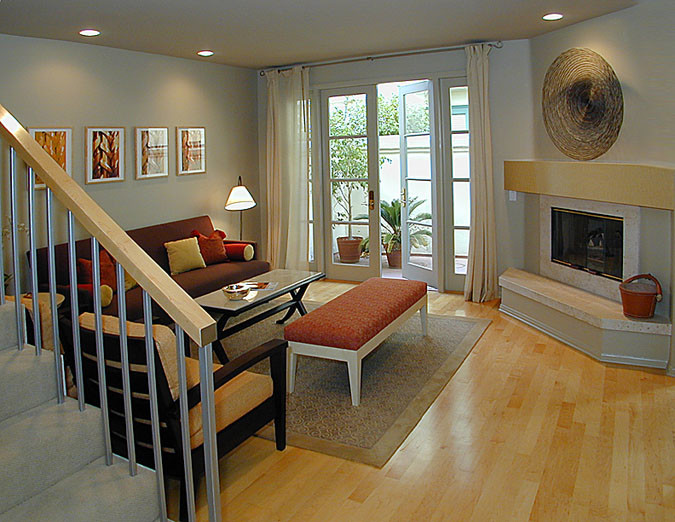 Mid-sized trendy formal and enclosed light wood floor living room photo in San Francisco with gray walls, a standard fireplace and a stone fireplace