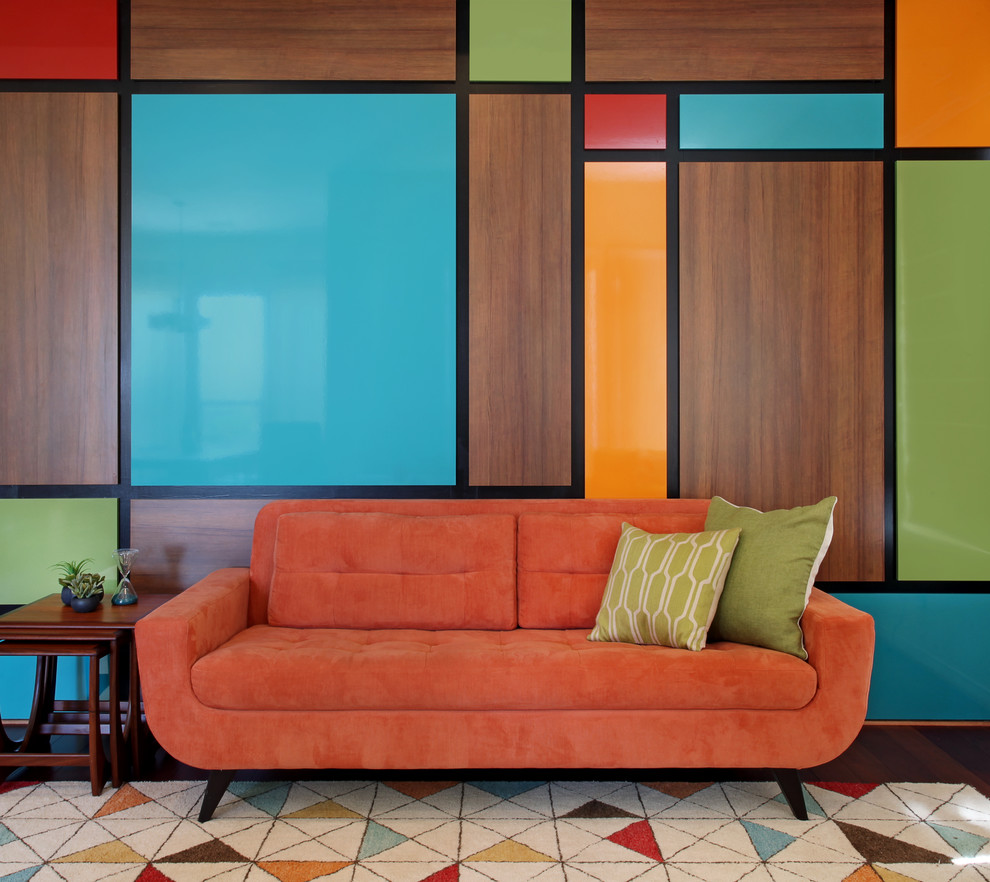 Living room - mid-sized 1960s medium tone wood floor living room idea in Orange County with multicolored walls