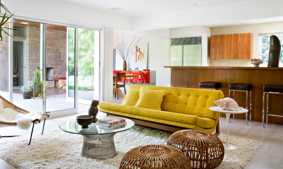 Inspiration for a midcentury living room in Los Angeles with green floors.