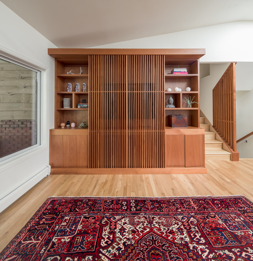 Esempio di un soggiorno minimalista di medie dimensioni e aperto con parete attrezzata