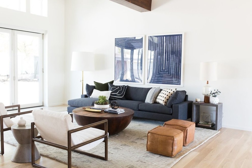 This is an example of a classic living room in Salt Lake City with white walls, light hardwood flooring, no fireplace, no tv and pink floors.