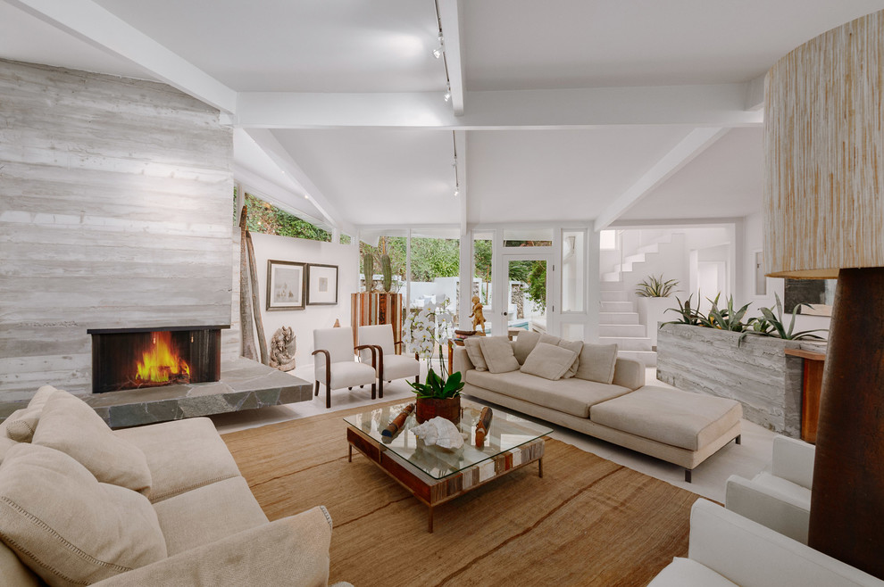 Inspiration for a huge mid-century modern formal and open concept white floor living room remodel in Los Angeles with white walls, a two-sided fireplace, a concrete fireplace and no tv