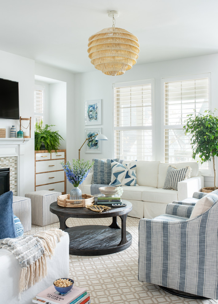 Mid-sized beach style open concept dark wood floor and brown floor living room photo in Raleigh with white walls, a tile fireplace and a wall-mounted tv