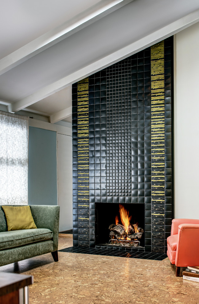 Inspiration for a retro living room in Detroit with a standard fireplace and a tiled fireplace surround.