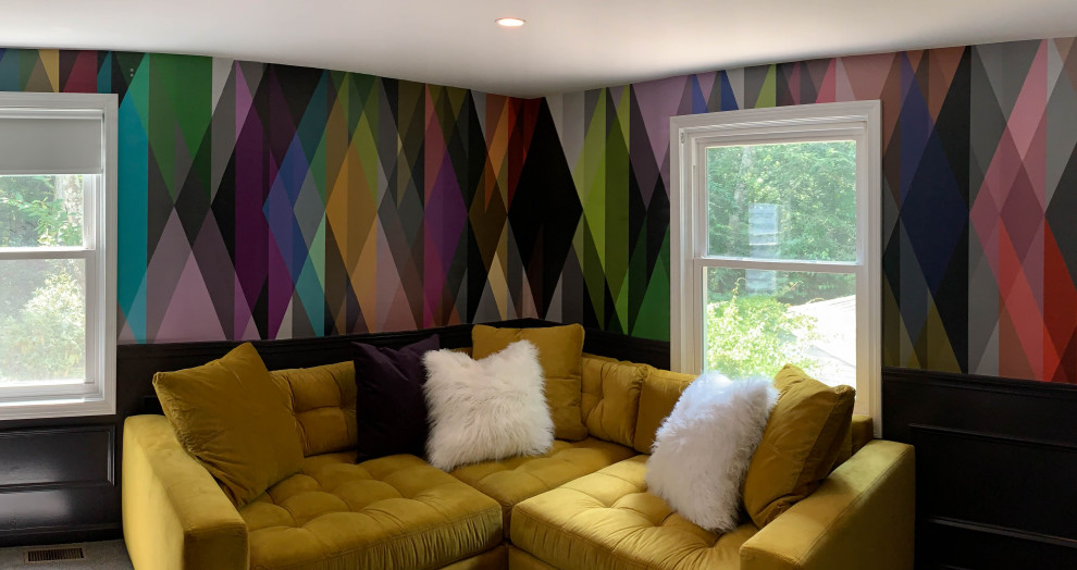 This is an example of a small midcentury enclosed living room in Boston with a home bar, multi-coloured walls, carpet, a wall mounted tv and grey floors.