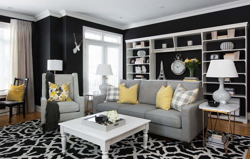 Foto di un soggiorno minimal di medie dimensioni e aperto con sala formale, pareti nere e parquet chiaro