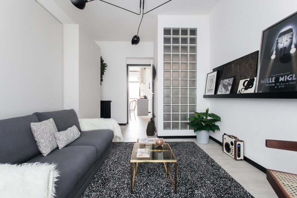 Inspiration for a scandinavian light wood floor and beige floor living room remodel in Melbourne with white walls