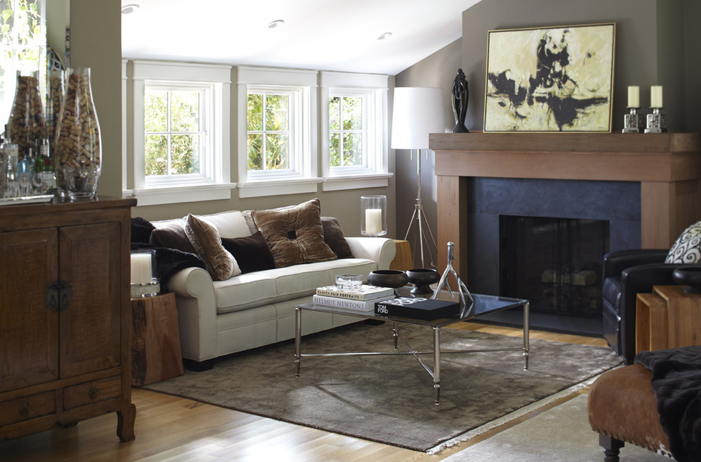 Transitional enclosed living room photo in San Francisco with gray walls and a standard fireplace