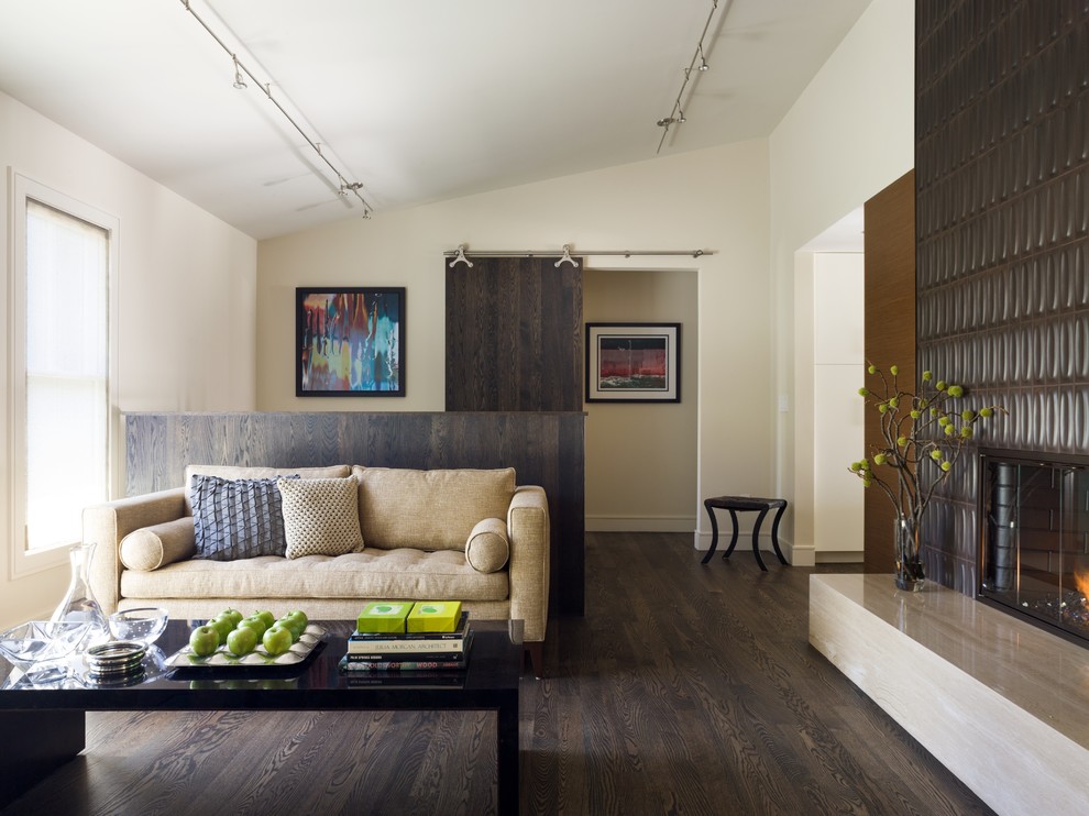 Medium sized contemporary living room in San Francisco with dark hardwood flooring and a tiled fireplace surround.