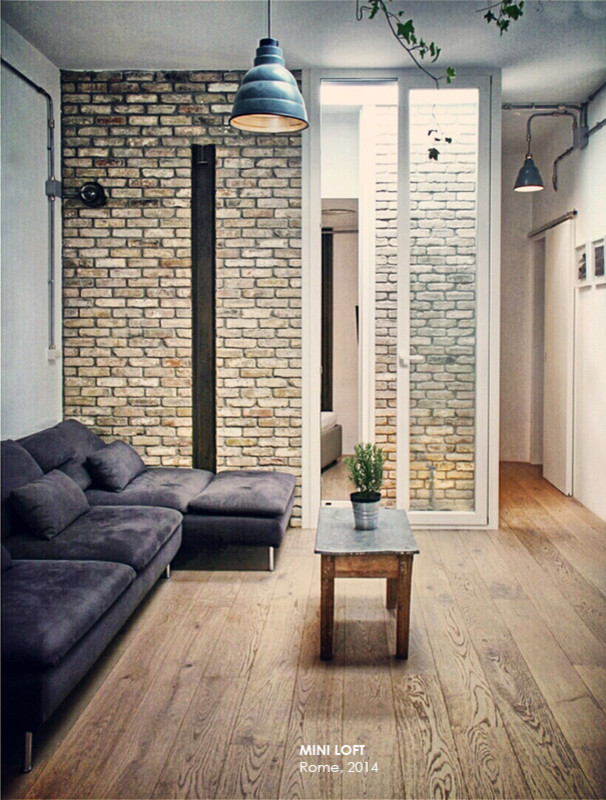 Idee per un piccolo soggiorno industriale stile loft con pavimento in legno massello medio