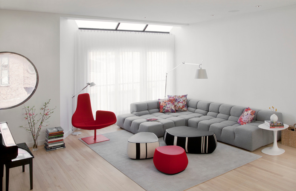 Living room - scandinavian light wood floor living room idea in Chicago with white walls