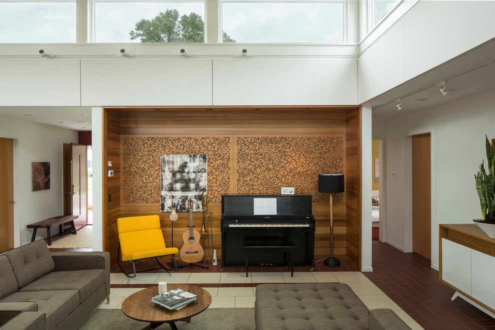 Photo of a contemporary living room in Minneapolis with a music area, white walls and feature lighting.