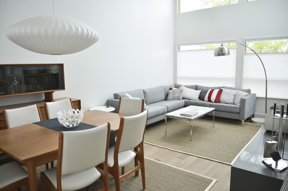 Example of a mid-sized trendy living room design in Calgary with white walls