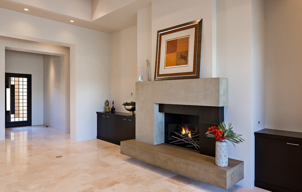 This is an example of a large contemporary formal open plan living room in Phoenix with white walls, travertine flooring, a standard fireplace, a concrete fireplace surround, no tv and beige floors.