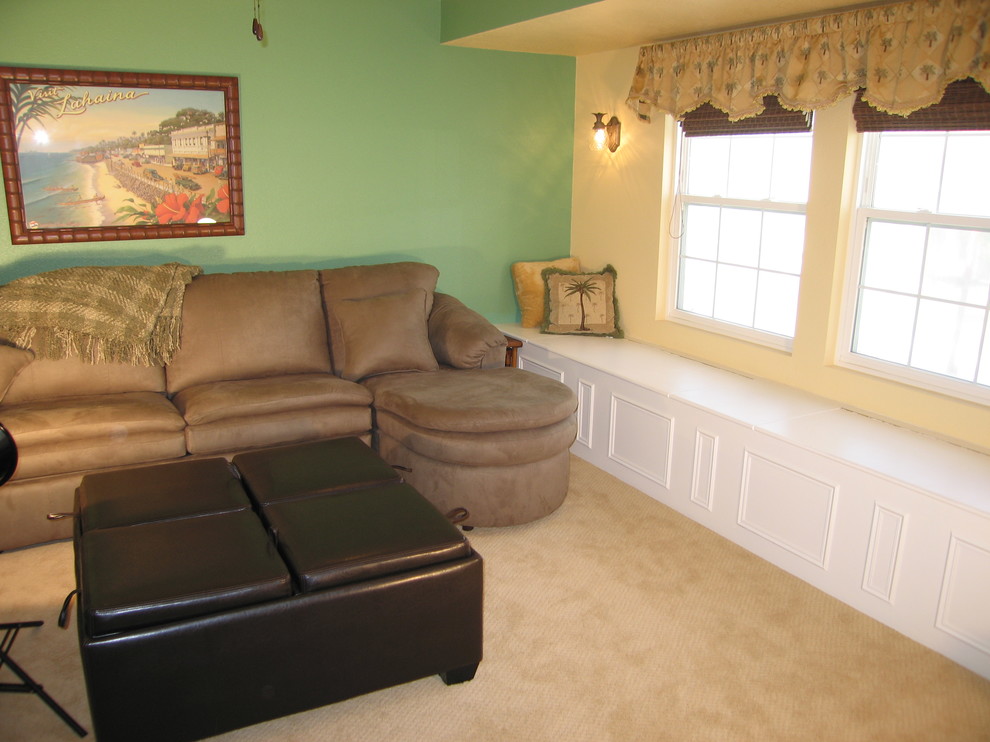 This is an example of a large nautical mezzanine living room in Orange County with a home bar, green walls and carpet.