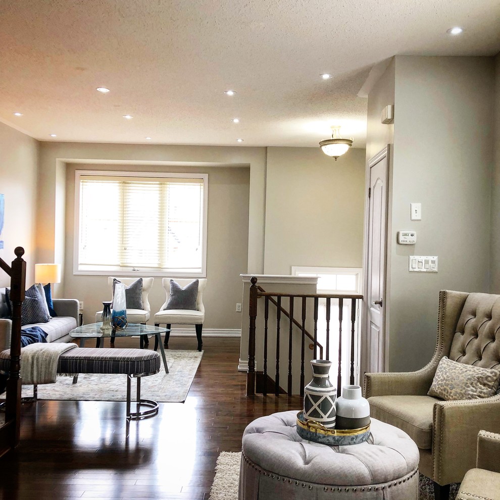 Photo of a small contemporary open plan living room in Toronto with grey walls, dark hardwood flooring, no fireplace and brown floors.