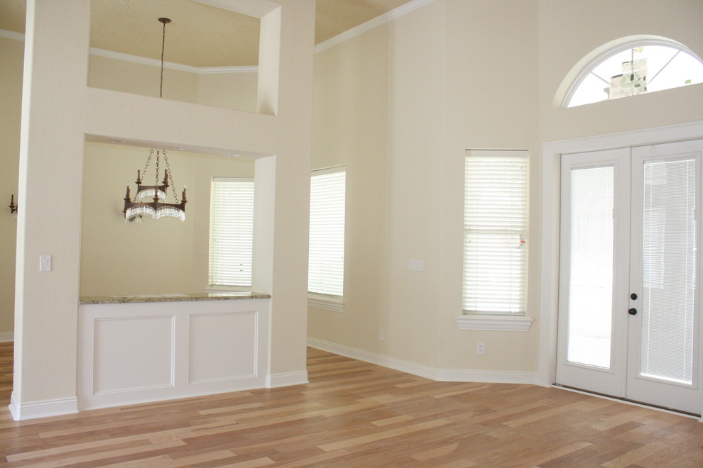 Living room - contemporary light wood floor living room idea in New Orleans with beige walls