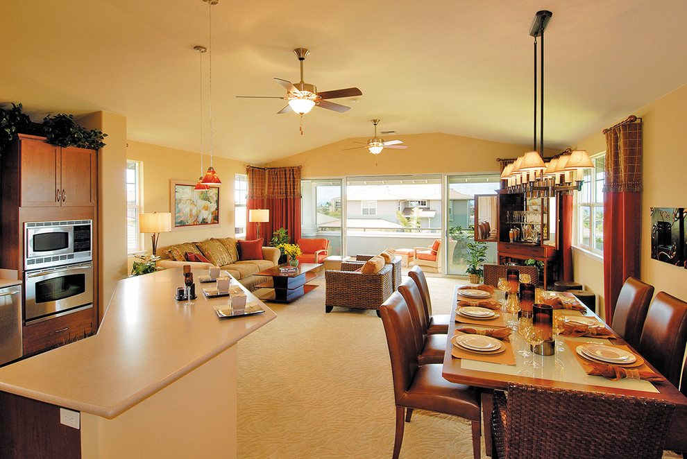 Contemporary open plan living room in Hawaii with beige walls and carpet.