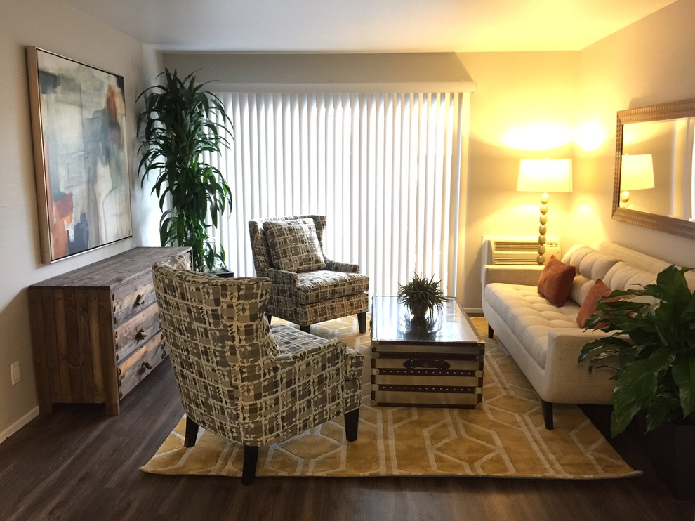 Example of a mid-sized trendy open concept dark wood floor living room design in Sacramento with beige walls, no fireplace and no tv