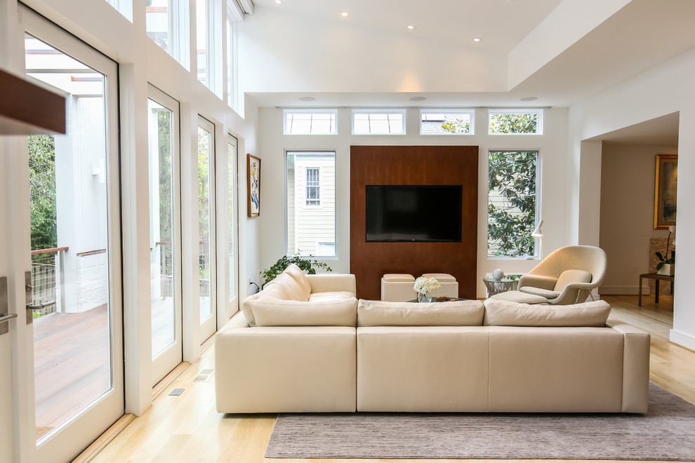 Photo of a large contemporary open plan living room in DC Metro with a music area, brown walls, light hardwood flooring, no fireplace, a built-in media unit and beige floors.