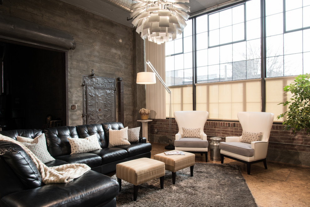 Example of an urban formal and open concept plywood floor living room design in St Louis with gray walls and a wall-mounted tv