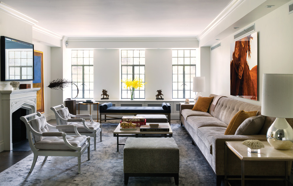 Photo of a traditional formal enclosed living room in New York with white walls and a standard fireplace.