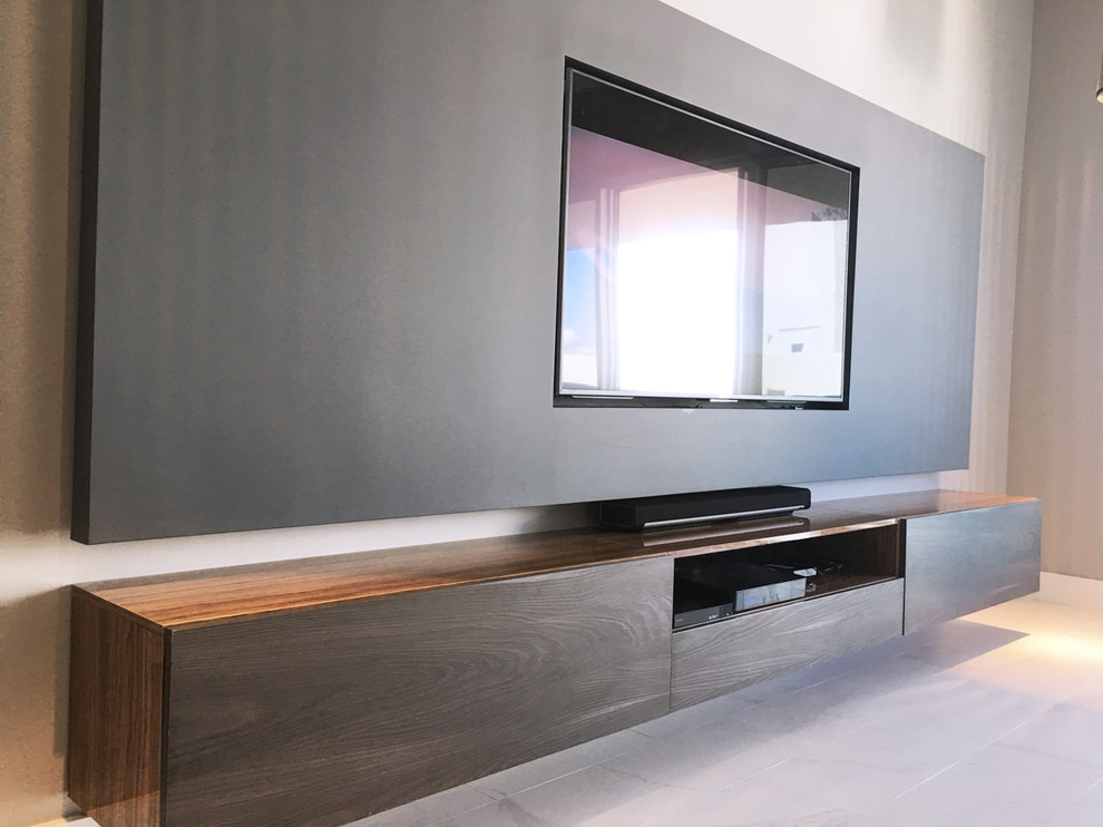 This is an example of a small modern mezzanine living room in Miami with grey walls, marble flooring, a built-in media unit and white floors.