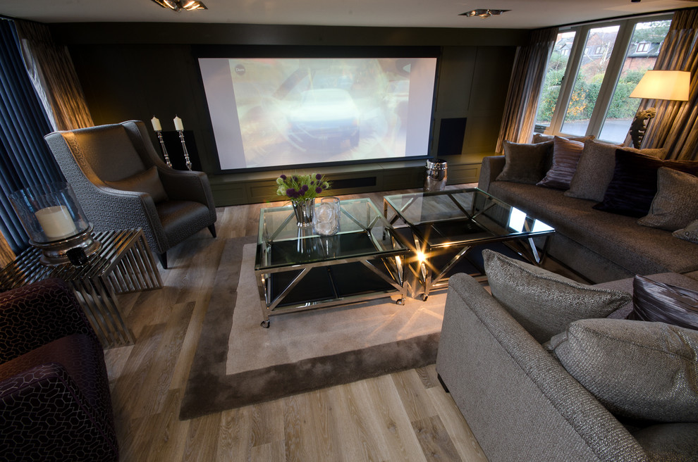 Large modern formal enclosed living room in West Midlands with green walls and a wall mounted tv.
