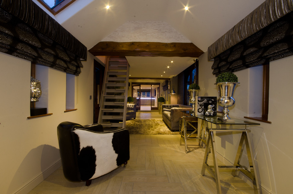 Large modern open plan living room in West Midlands with a music area, white walls and ceramic flooring.