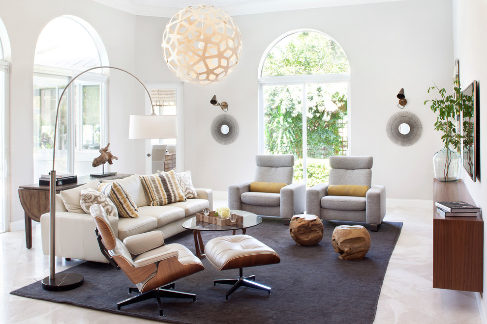Medium sized contemporary enclosed living room in Miami with white walls, travertine flooring and a wall mounted tv.
