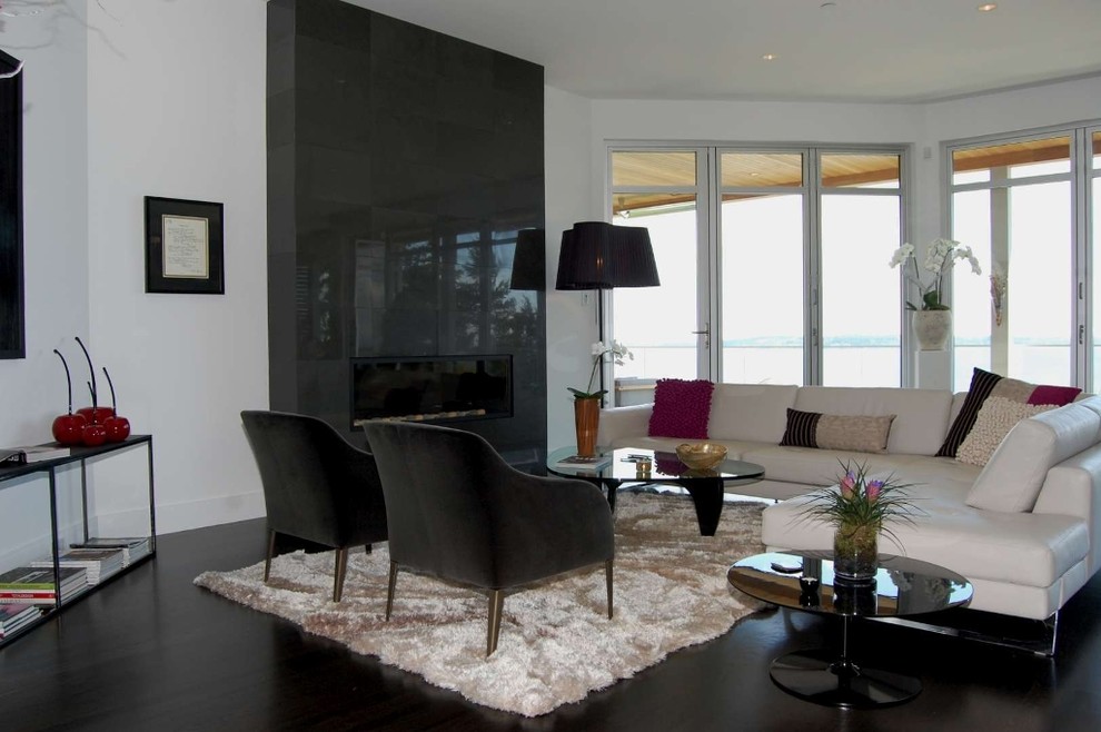 This is an example of a medium sized modern open plan living room in Vancouver with white walls.