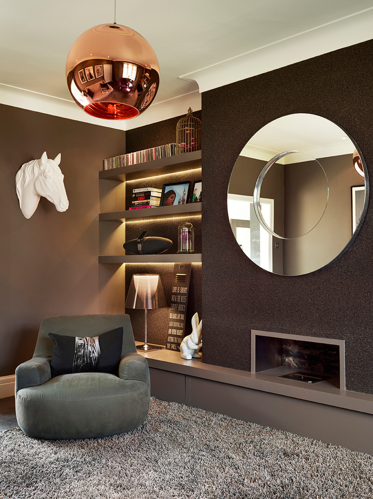 This is an example of a small contemporary formal enclosed living room in Other with brown walls, carpet, a ribbon fireplace and a metal fireplace surround.