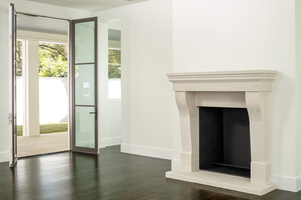 Living room - mid-sized traditional enclosed dark wood floor living room idea in Dallas with white walls, a standard fireplace and a plaster fireplace