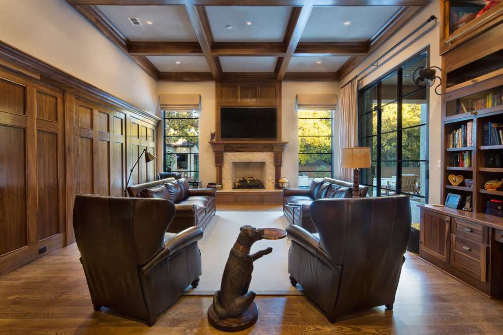 Photo of a medium sized country formal enclosed living room in Dallas with white walls, medium hardwood flooring, a standard fireplace, a wooden fireplace surround and a wall mounted tv.
