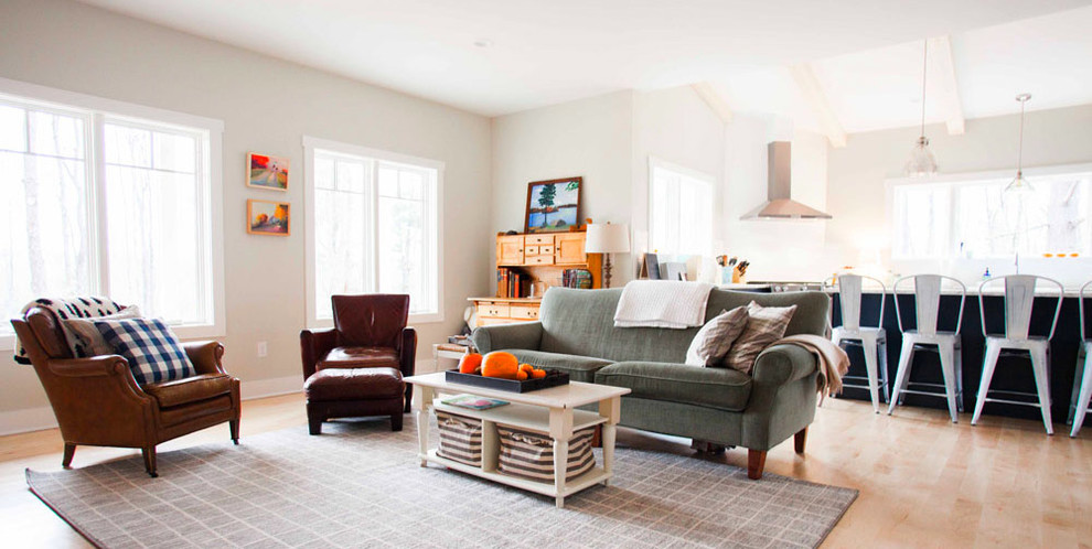 Inspiration for a country open plan living room in Other with white walls, light hardwood flooring, a two-sided fireplace and a brick fireplace surround.