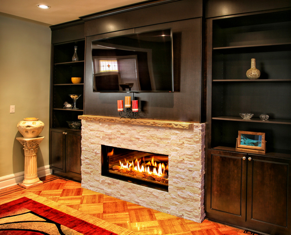 Large contemporary formal open plan living room in New York with green walls, medium hardwood flooring, a ribbon fireplace, a stone fireplace surround, a wall mounted tv and brown floors.