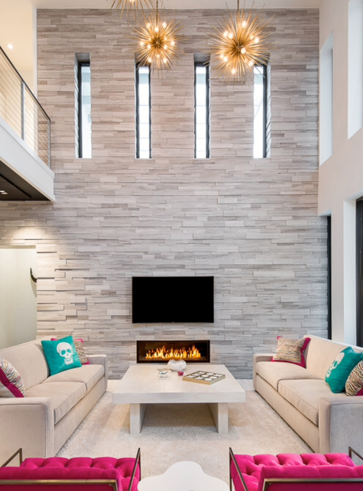 Example of a large trendy open concept living room design in Miami with gray walls, a ribbon fireplace and a wall-mounted tv