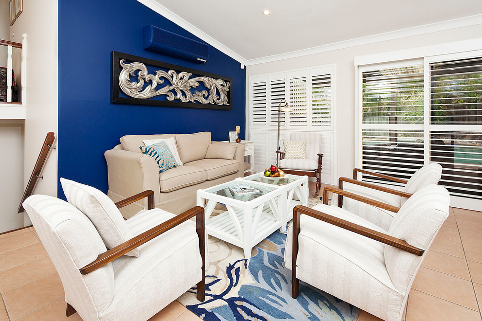 Foto di un soggiorno tradizionale di medie dimensioni con pareti blu
