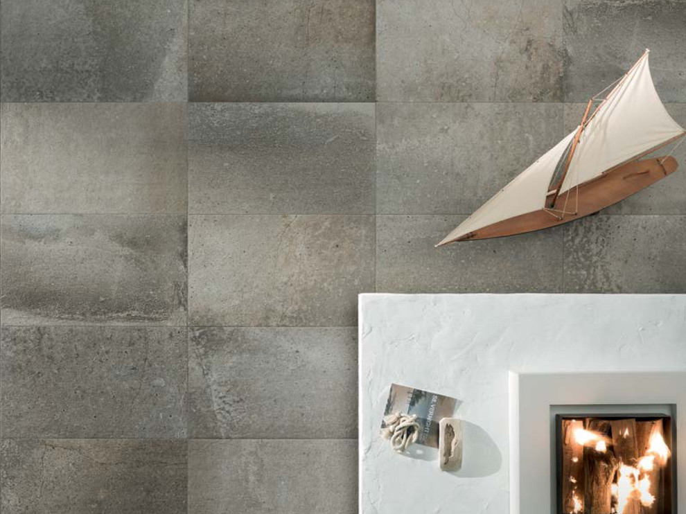 Idee per un soggiorno minimalista di medie dimensioni con pareti grigie, pavimento in gres porcellanato e pavimento grigio
