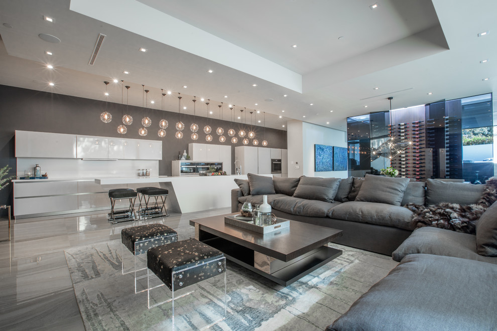 Living room - contemporary open concept gray floor living room idea in Los Angeles with gray walls