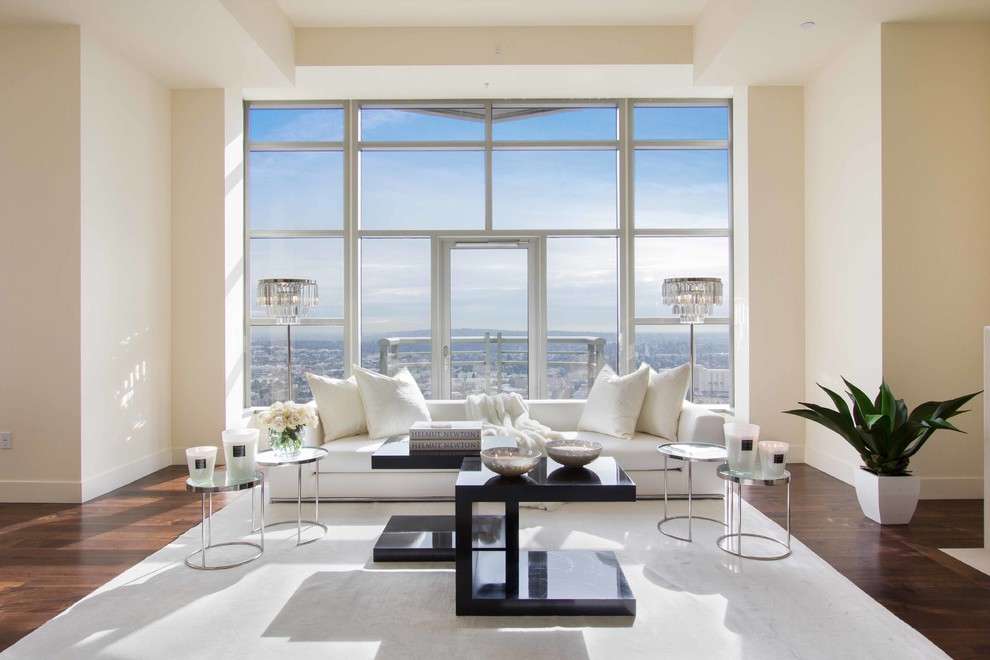 Photo of a large contemporary open plan living room in Los Angeles with white walls and medium hardwood flooring.