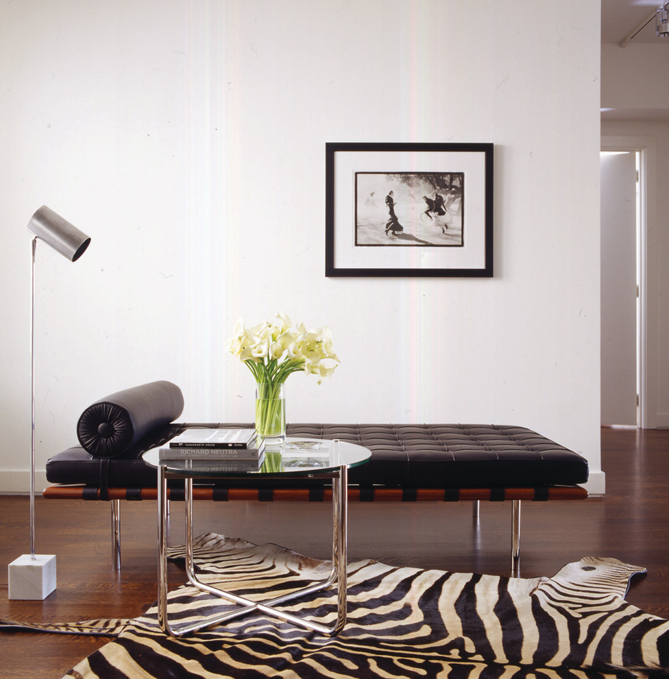 Living room - large modern loft-style dark wood floor living room idea in New York with white walls