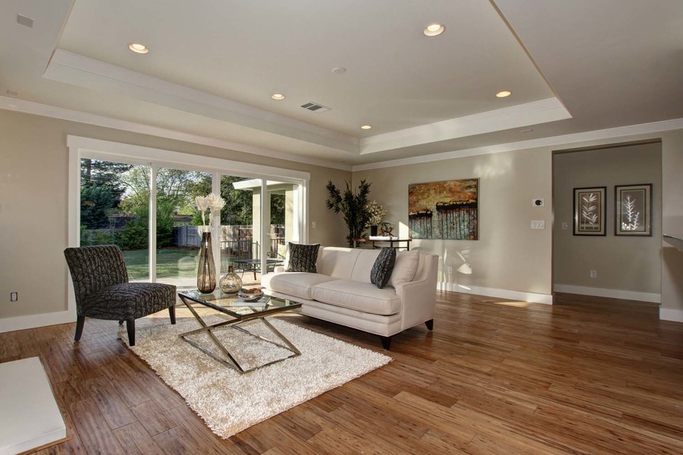 Mid-sized trendy open concept light wood floor living room photo in Austin with beige walls and a wall-mounted tv