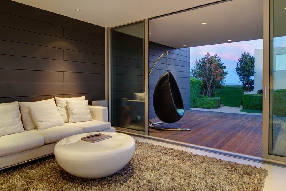Esempio di un soggiorno moderno con pareti marroni