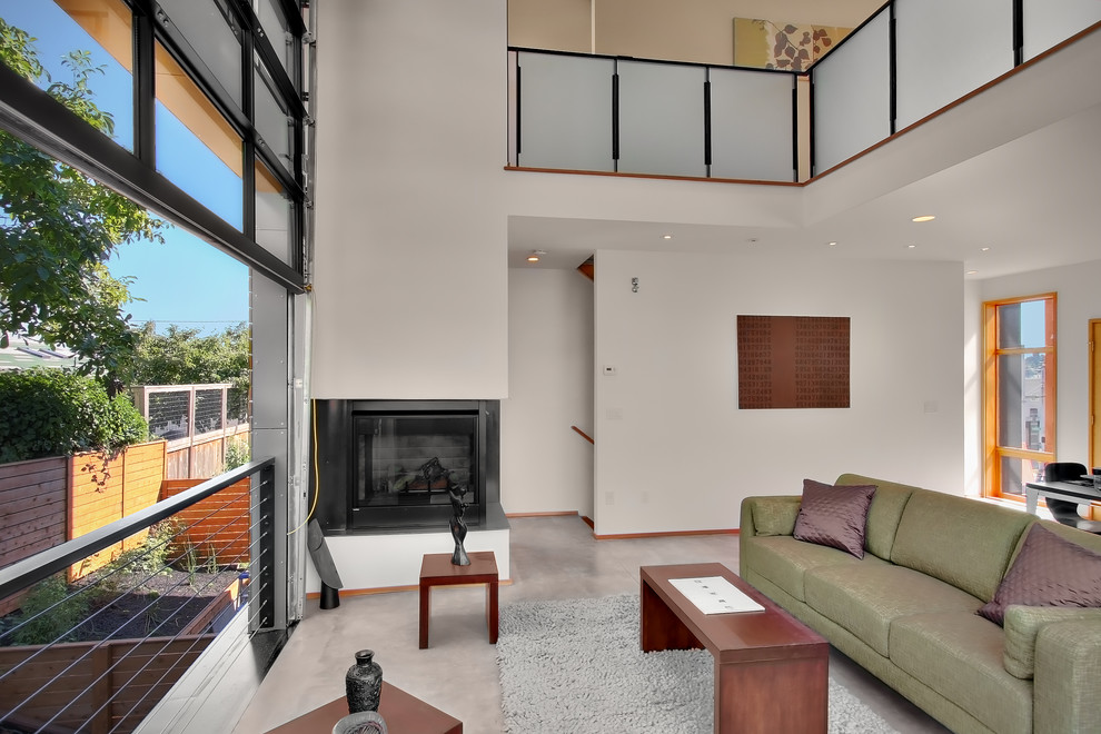 Living room - contemporary living room idea in Seattle with a corner fireplace