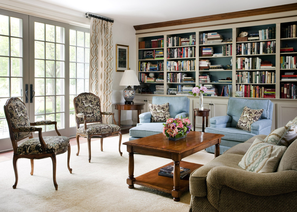 Foto di un soggiorno moderno con libreria e tappeto