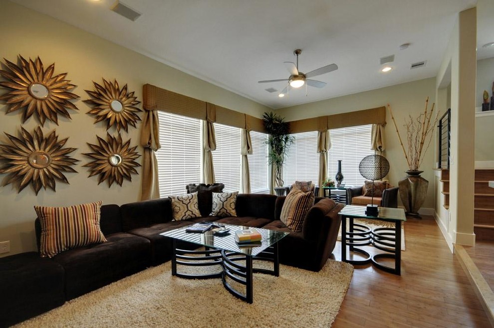 Inspiration for a large classic open plan living room in Houston with beige walls and bamboo flooring.