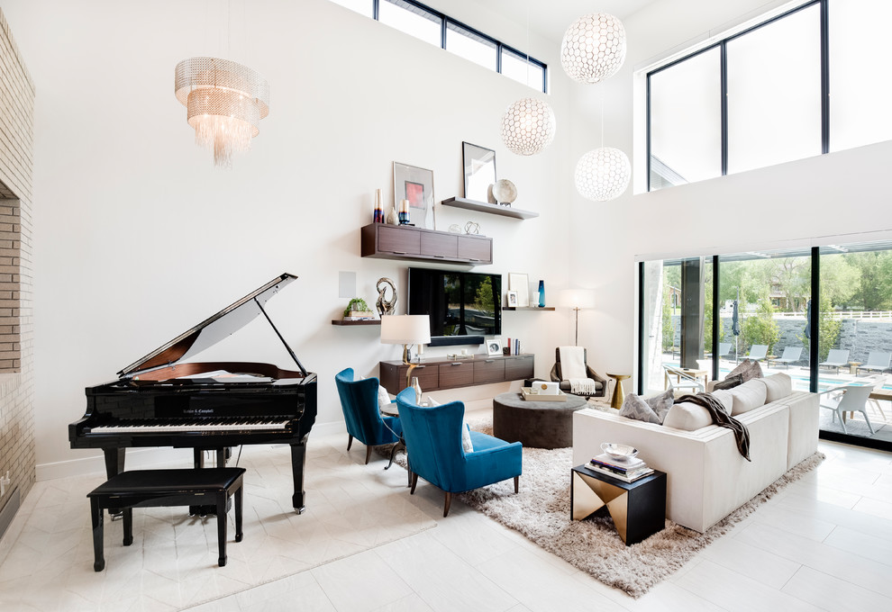 Photo of a contemporary open plan living room in Salt Lake City with white walls, a wall mounted tv and white floors.