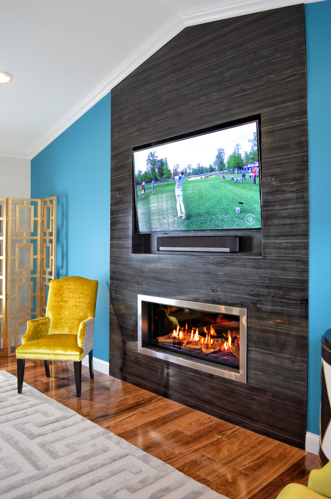 Large trendy open concept dark wood floor and brown floor living room photo in New York with blue walls, a ribbon fireplace, a tile fireplace and a wall-mounted tv