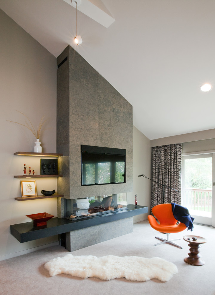Medium sized contemporary formal enclosed living room in New York with beige walls, carpet, a two-sided fireplace, a plastered fireplace surround and a wall mounted tv.